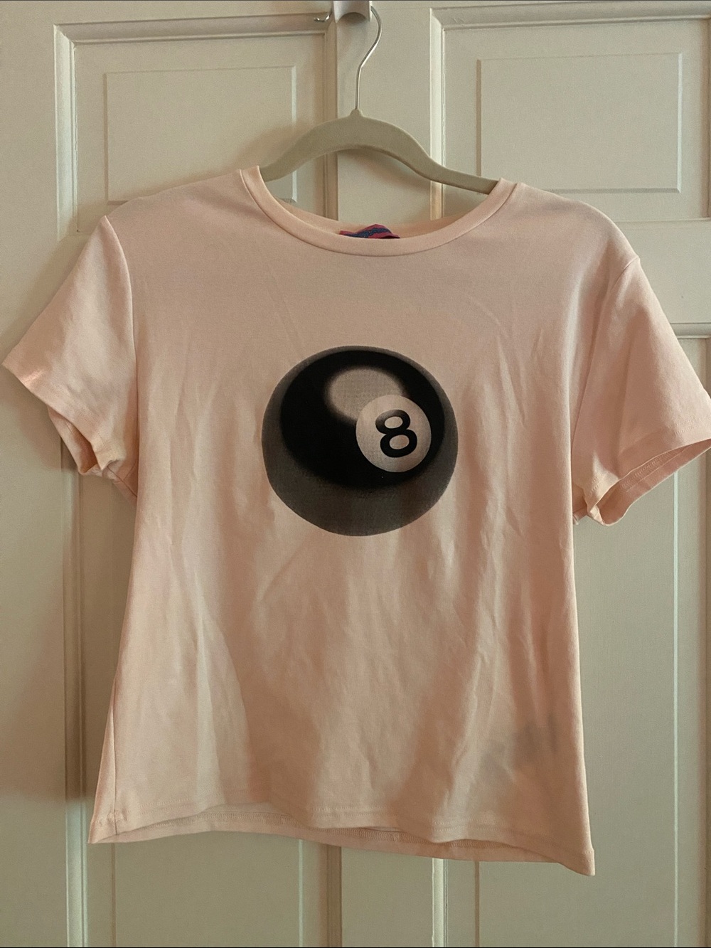 Edikted Pale Pink Short Sleeve Tee with Black 8-Ball Graphic